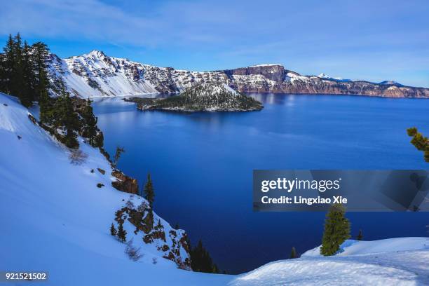 snowcapped wizard island in winter, crater lake national park, oregon - crater lake stock pictures, royalty-free photos & images