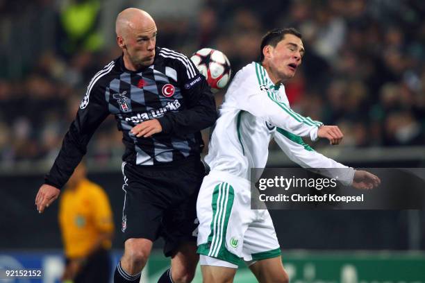 Fabian Ernst of Besiktas Istanbul and Marcel Schaefer of Wolfsburg go up for a header during the UEFA Champions League Group B first leg match...