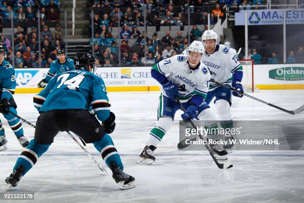 Nikolay Goldobin of the Vancouver Canucks skates with the puck against Dylan DeMelo of the San Jose Sharks at SAP Center on February 15, 2018 in San...