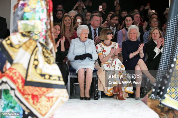 Queen Elizabeth II sits with Anna Wintour, Caroline Rush , chief executive of the British Fashion Council and royal dressmaker Angela Kelly as they...