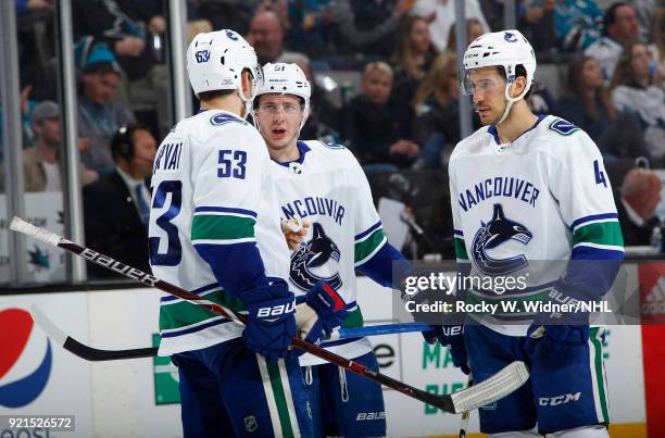 Bo Horvat, Troy Stecher and Michael Del Zotto of the Vancouver Canucks talk during the game against the San Jose Sharks at SAP Center on February 15,...