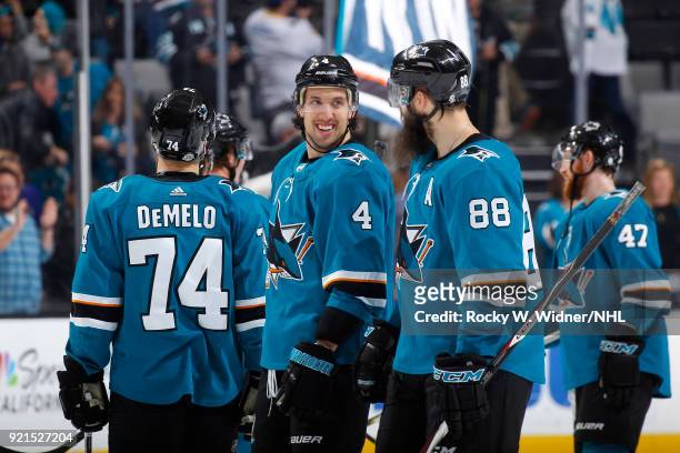 Brenden Dillon and Brent Burns of the San Jose Sharks celebrate after defeating the Vancouver Canucks at SAP Center on February 15, 2018 in San Jose,...