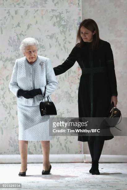 Queen Elizabeth II and Chief Executive of the British Fashion Council Caroline Rush attend the Richard Quinn show during London Fashion Week February...