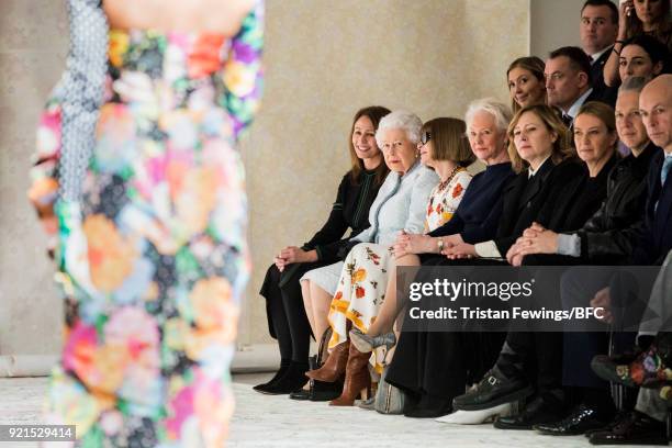 Queen Elizabeth II , Chief Executive of the British Fashion Council Caroline Rush and Anna Wintour watch model Adwoa Aboah walking the runway at the...