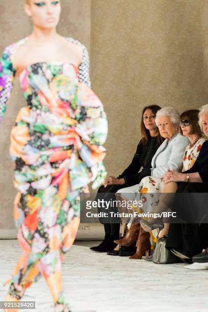 Queen Elizabeth II , Chief Executive of the British Fashion Council Caroline Rush and Anna Wintour watch model Adwoa Aboah walking the runway at the...
