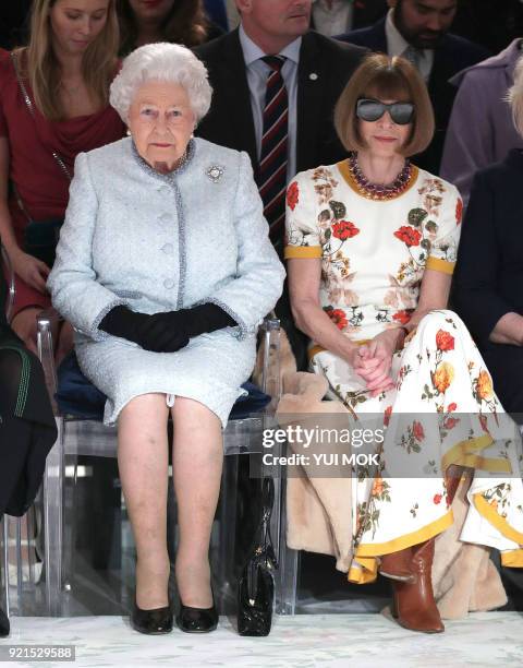 Britain's Queen Elizabeth II, accompanied by British-American journalist and editor, Anna Wintour , views British designer Richard Quinn's runway...