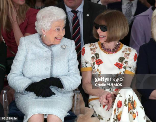 Britain's Queen Elizabeth II, accompanied by British-American journalist and editor, Anna Wintour , views British designer Richard Quinn's runway...
