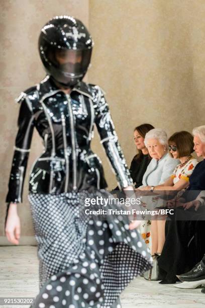 Model walks the Richard Quinn show with Queen Elizabeth II , Chief Executive of the British Fashion Council Caroline Rush and Anna Wintour in...