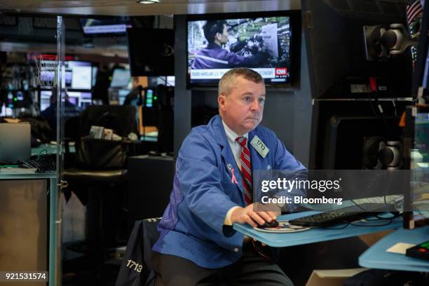 Trader works on the floor of the New York Stock Exchange in New York, U.S., on Tuesday, Feb. 20, 2018. Treasuries fell, with investors driving the...