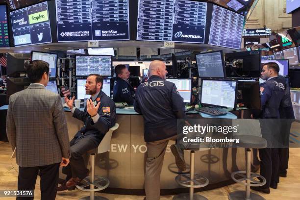 Traders work on the floor of the New York Stock Exchange in New York, U.S., on Tuesday, Feb. 20, 2018. Treasuries fell, with investors driving the...