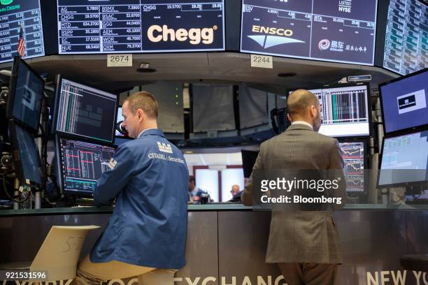 Traders work on the floor of the New York Stock Exchange in New York, U.S., on Tuesday, Feb. 20, 2018. Treasuries fell, with investors driving the...