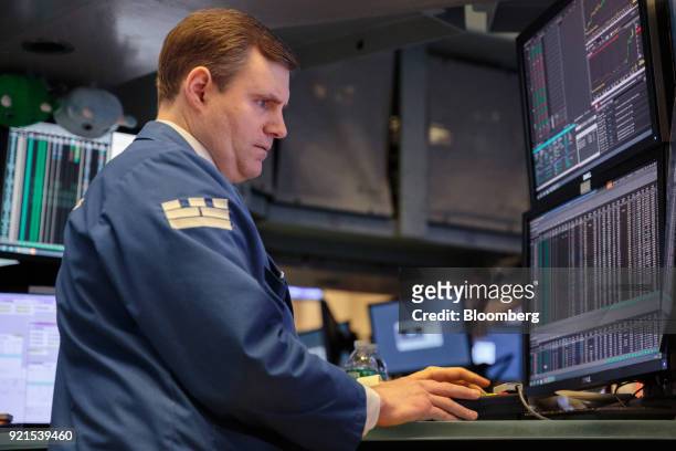 Trader works on the floor of the New York Stock Exchange in New York, U.S., on Tuesday, Feb. 20, 2018. Treasuries fell, with investors driving the...