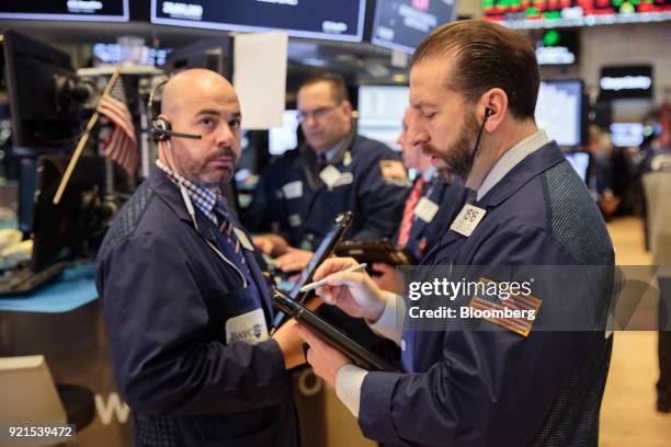 Traders work on the floor of the New York Stock Exchange in New York, U.S., on Tuesday, Feb. 20, 2018. Treasuries fell, with investors driving the...