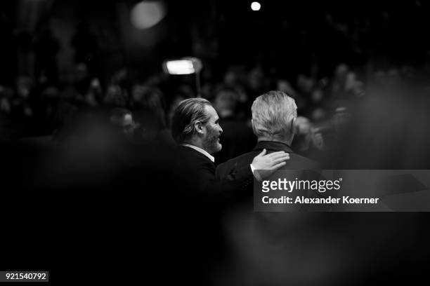 Joaquin Phoenix and Udo Kier attend the 'Don't Worry, He Won't Get Far on Foot' premiere during the 68th Berlinale International Film Festival Berlin...