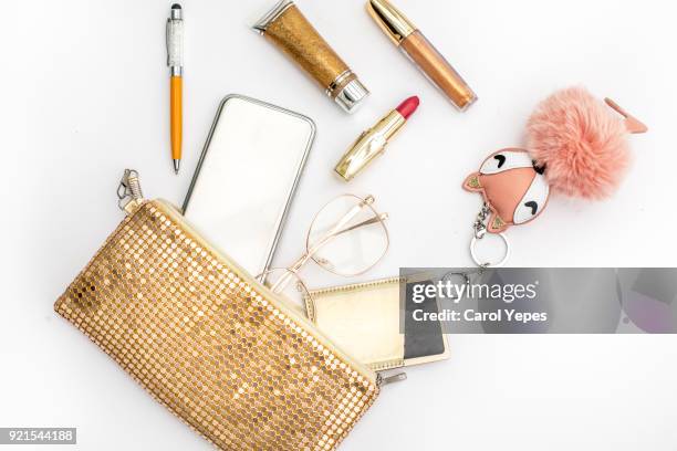 women's fashion. black handbag, makeup brushes on white background. flat composition. magazines, social media. top view. flat lay. - sac à main blanc photos et images de collection