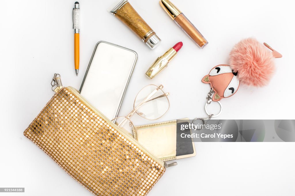 Women's fashion. black handbag, makeup brushes on white background. Flat composition. magazines, social media. Top view. Flat lay.