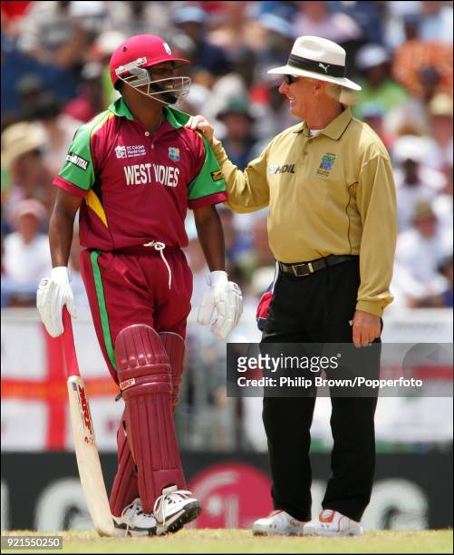 West Indies batsman Brian Lara jokes with umpire Rudi Koertzen during the World Cup Super Eight match between West Indies and England at the...
