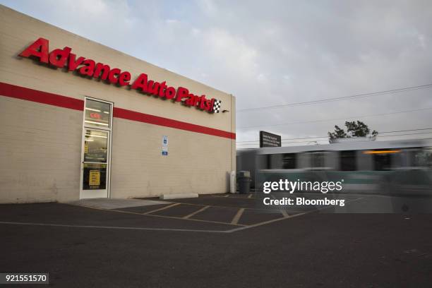 Bus drives past an Advance Auto Parts Inc. Store in Phoenix, Arizona, U.S., on Monday, Feb. 19, 2018. Advance Auto Parts is scheduled to release...