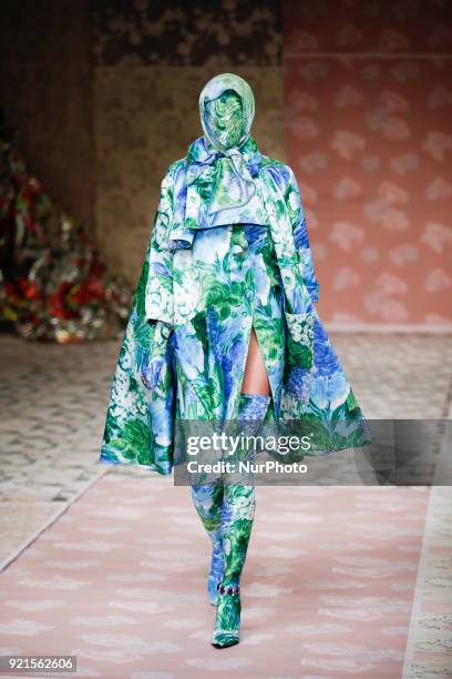 Model walks the runway at the Richard Quinn show during London Fashion Week February 2018 at BFC Show Space on February 20, 2018 in London, England.