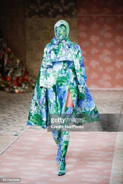 Model walks the runway at the Richard Quinn show during London Fashion Week February 2018 at BFC Show Space on February 20, 2018 in London, England.