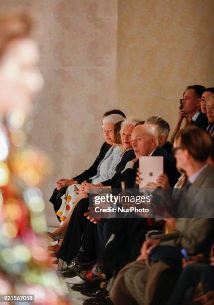 The Queen Elizabeth II is presenting the award which carries her name to the winning designer Richard Quinn at the London Fashion Week on the...