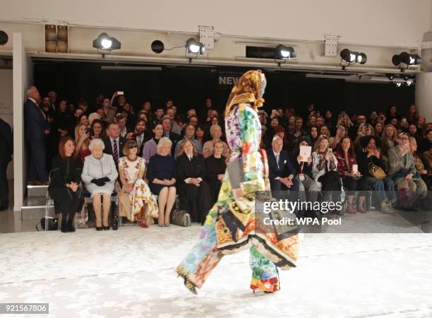 Queen Elizabeth II sits with Anna Wintour , Caroline Rush , chief executive of the British Fashion Council and royal dressmaker Angela Kelly as they...