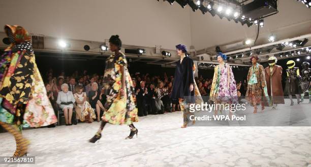 Queen Elizabeth II sits with Anna Wintour , Caroline Rush , chief executive of the British Fashion Council and royal dressmaker Angela Kelly as they...