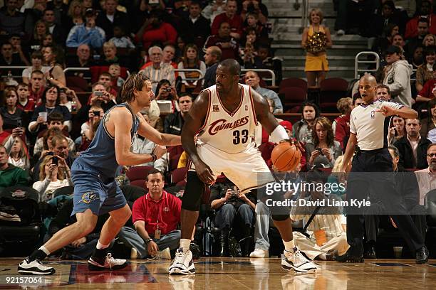 Shaquille O'Neal of the Cleveland Cavaliers handles the ball against Fabricio Oberto of the Washington Wizards during the preseason game on October...