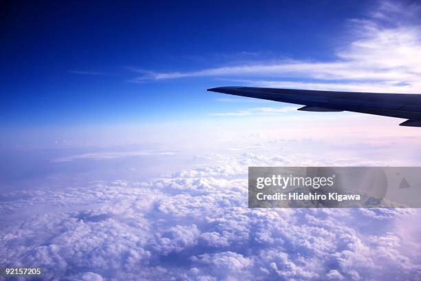 blue sky and clouds from the airplane. - hidehiro kigawa stockfoto's en -beelden