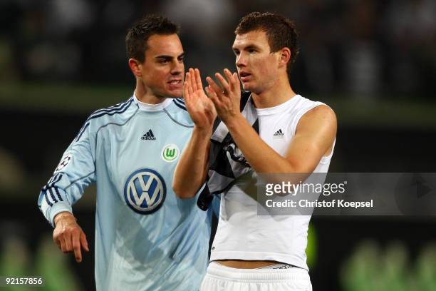 Diego Benaglio of Wolfsburg and Edin Dzeko of Wolfsburg look dejected after the 1-1 draw of the UEFA Champions League Group B first leg match between...