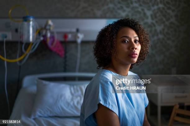 thoughtful female patient sitting at hospital - 18 wall stock pictures, royalty-free photos & images