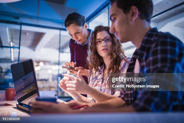 creative, young, office coworkers talking during meeting together in design studio - social entrepreneur stock pictures, royalty-free photos & images