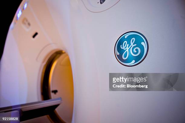 General Electric Co. Logo is seen on the side of a Discovery CT750 HD CT scan machine as it sits on display prior to a news conference in New York,...