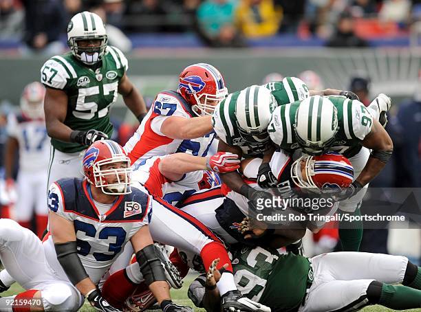 David Harris and Calvin Pace of the New York Jets sack Trent Edwards of the Buffalo Bills at Giants Stadium on October 18, 2009 in East Rutherford,...