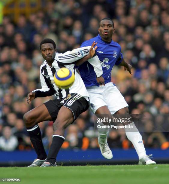 Shola Ameobi of Newcastle United and Joseph Yobo of Everton in action during the Barclays Premiership match between Everton and Newcastle United at...