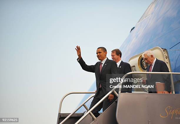 President Barack Obama steps off Air Force One with Rep Jon Adler and Senator Frank Lautenberg October 21, 2009 upon arrival at Newark International...
