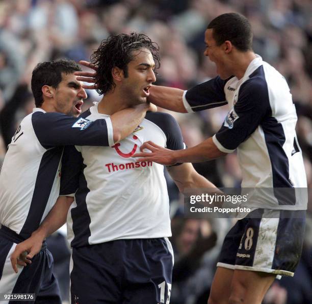 Mido of Tottenham Hotspur celebrates his goal with teammates Paul Stalteri and Jermaine Jenas during the Barclays Premiership match between Tottenham...