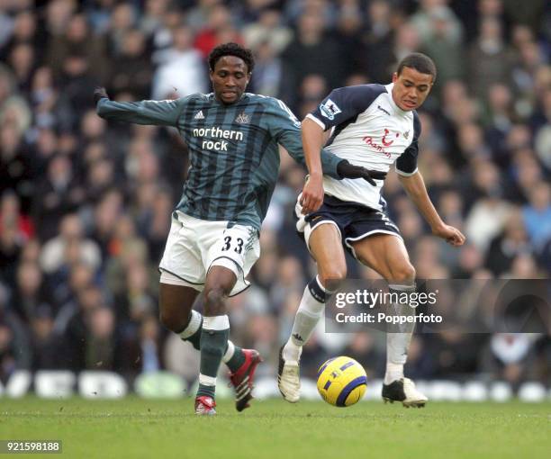 Jermaine Jenas of Tottenham Hotspur and Celestine Babayaro of Newcastle United in action during the Barclays Premiership match between Tottenham...