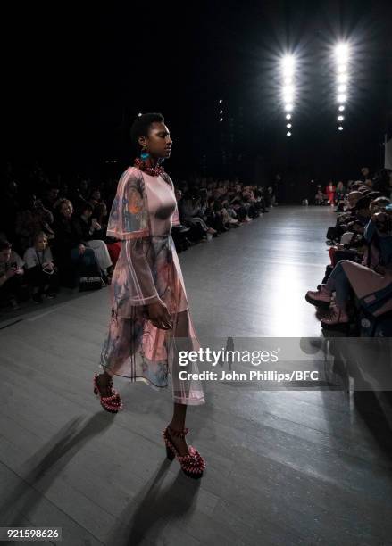 Model walks the runway at the On|Off Presents show during London Fashion Week February 2018 at BFC Show Space on February 20, 2018 in London, England.