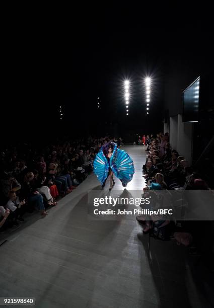 Model walks the runway at the On|Off Presents show during London Fashion Week February 2018 at BFC Show Space on February 20, 2018 in London, England.