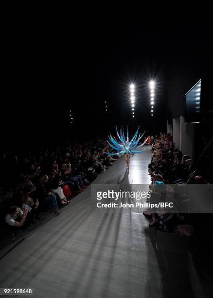 Model walks the runway at the On|Off Presents show during London Fashion Week February 2018 at BFC Show Space on February 20, 2018 in London, England.