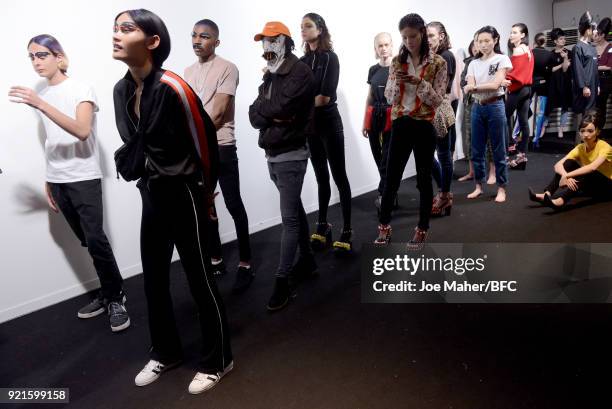 Models are seen backstage ahead of the On|Off Presents show during London Fashion Week February 2018 at BFC Show Space on February 20, 2018 in...