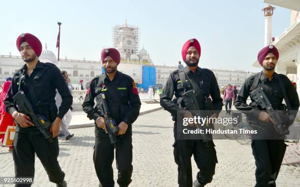 Punjab police Commando stand guard outside the Golden Temple in the wake of heightened security on the eve of Canadian Prime Minister Justin...