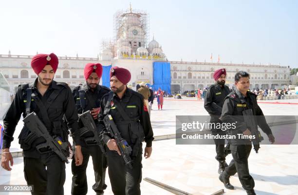 Punjab police Commando stand guard outside the Golden Temple in the wake of heightened security on the eve of Canadian Prime Minister Justin...