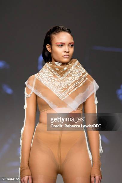 Model walks the runway at the On|Off Presents - This is the Uniform fashion show during London Fashion Week February 2018 at BFC Show Space on...