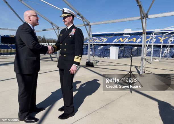 Deputy Commissioner Bill Daly and U.S. Naval Academy Superintendent Vice Admiral Walter E. "Ted" Carter, shake hands after a news conference to mark...