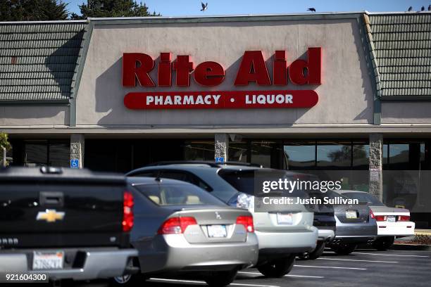 Sign is posted on the exterior of a Rite Aid store at the Fairmont Center on February 20, 2018 in Pacifica, California. Grocery chain Albertsons, a...