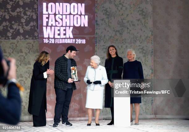 Queen Elizabeth II awards designer Richard Quinn the inaugural Queen Elizabeth II award for British Design alongside Chief Executive of the British...