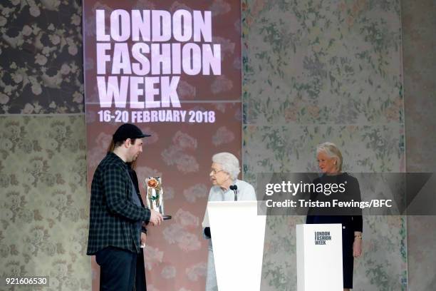 Queen Elizabeth II awards designer Richard Quinn the inaugural Queen Elizabeth II award for British Design during London Fashion Week February 2018...