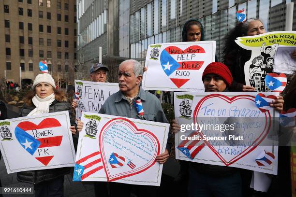 Puerto Rican activists and others participate in a protest outside of New York City's Federal Emergency Management Agency office to call on Congress...